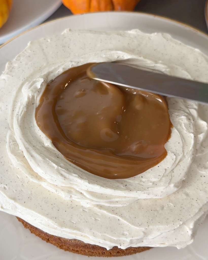 filling cake layer with homemade toffee sauce