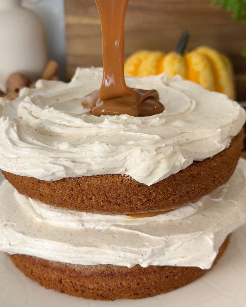 pouring homemade toffee sauce on cake layer